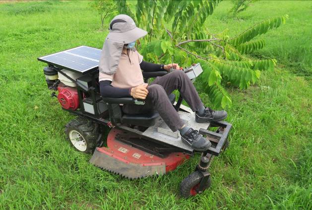 Hybrid remote control ride-on lawn mower