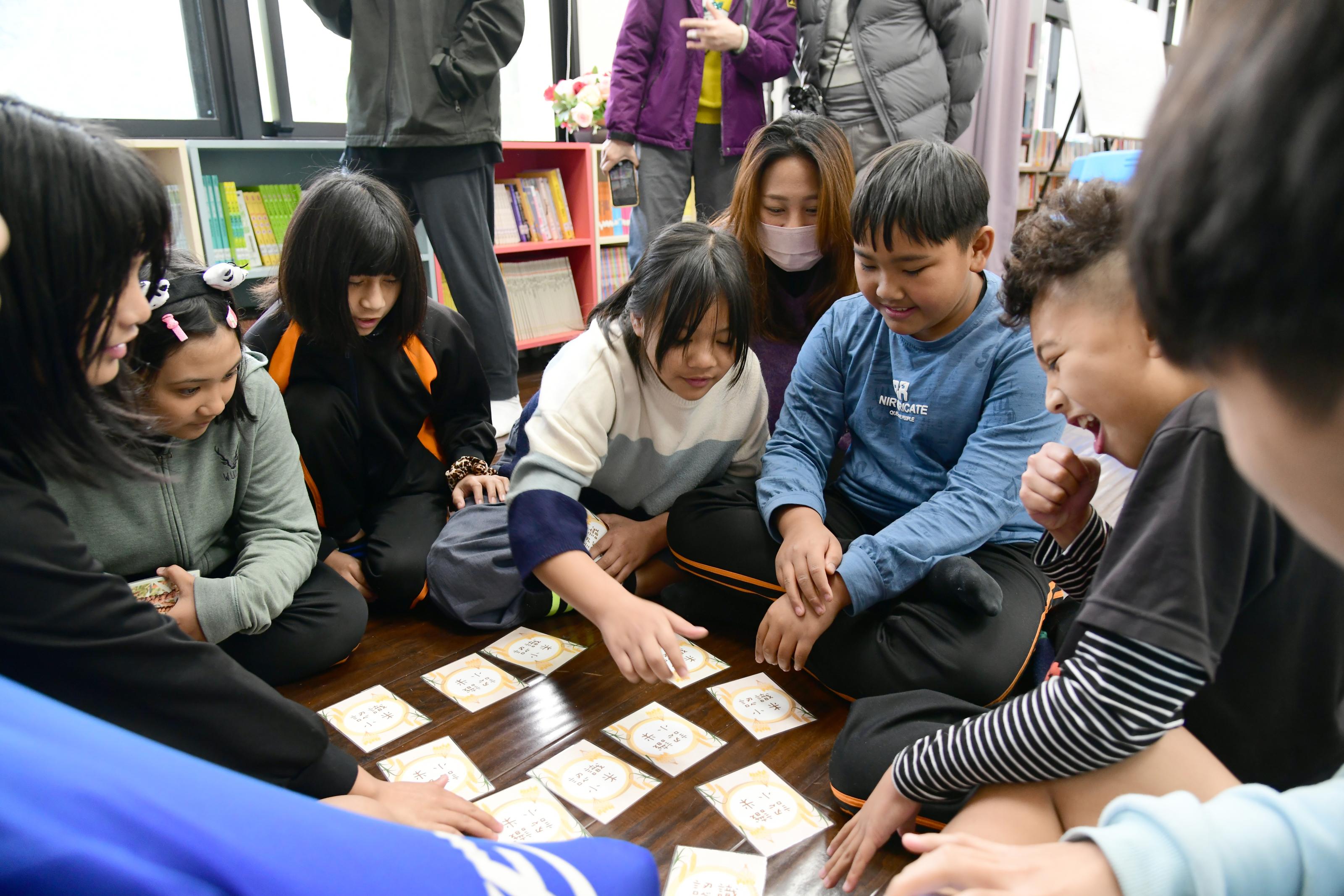 Students learning about millet by playing a card game.