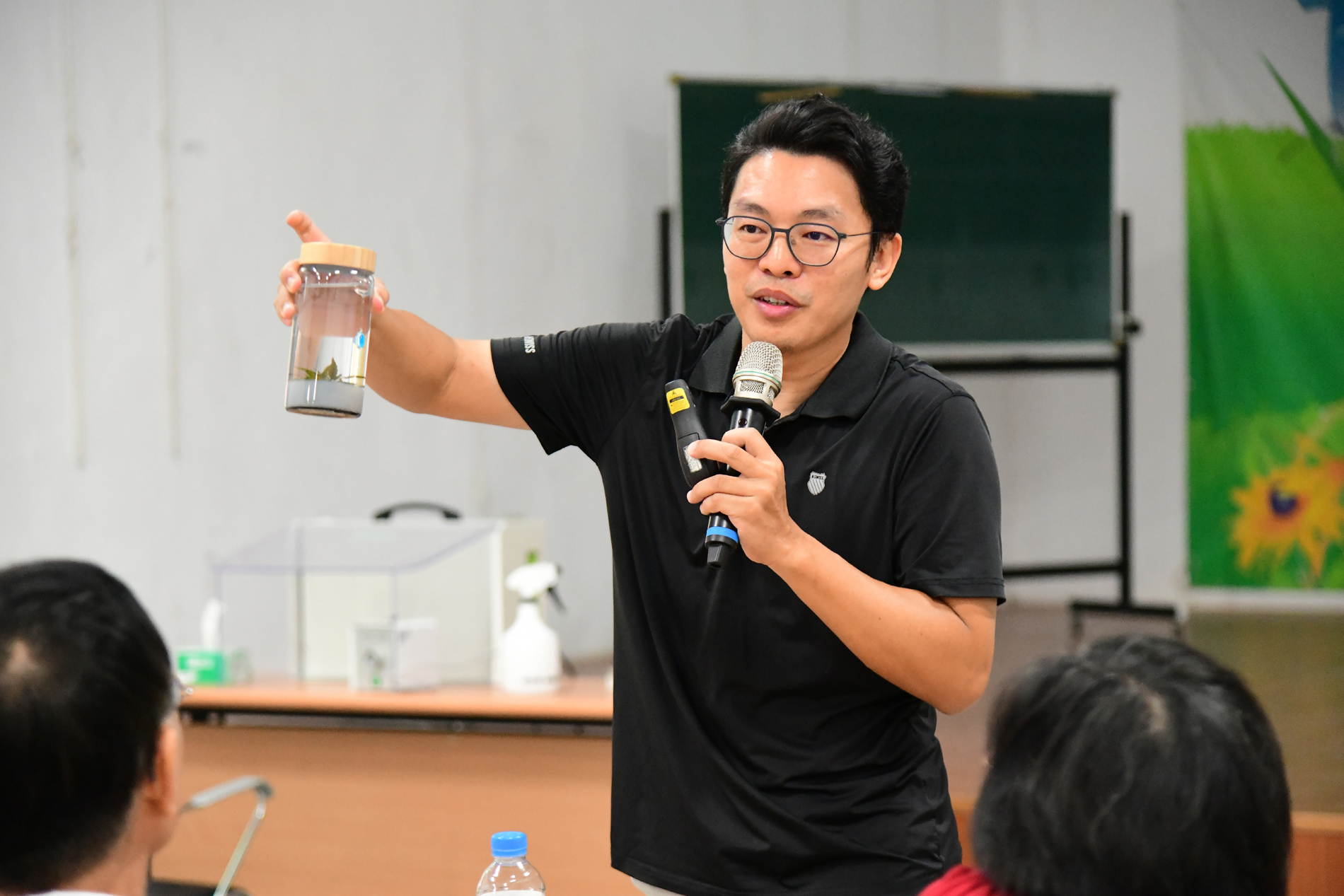 The instructor speaking in class.